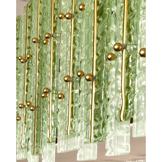 Contemporary gold chandelier in Murano Glass full of leaves that give a touch of “tropical” design. Extremally elegant and...
