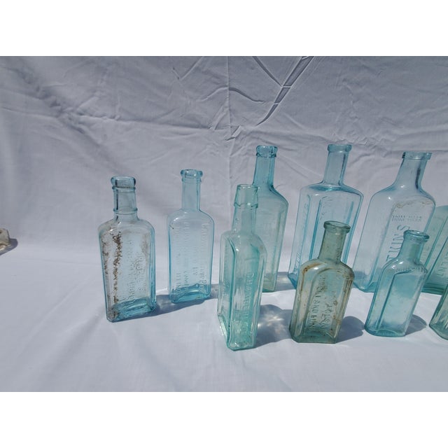 Set of 13 Late 19th Century Embossed Druggist/Pharmacy Bottles For Sale - Image 4 of 6