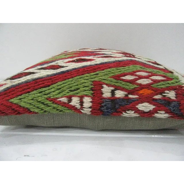 This is a pillow cover made from a vintage kilim rug. The piece was properly washed and ready to use. Pillow inserts not...