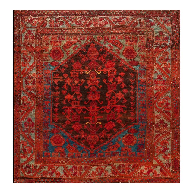 Beautiful Brown Background With Firey Reds and Sky Blue Antique Tribal and Rustic Turkish Kula Rug For Sale