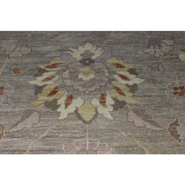 Hand-knotted wool Pakistani rug with an all-over design. The piece was made in the late 20th century.
