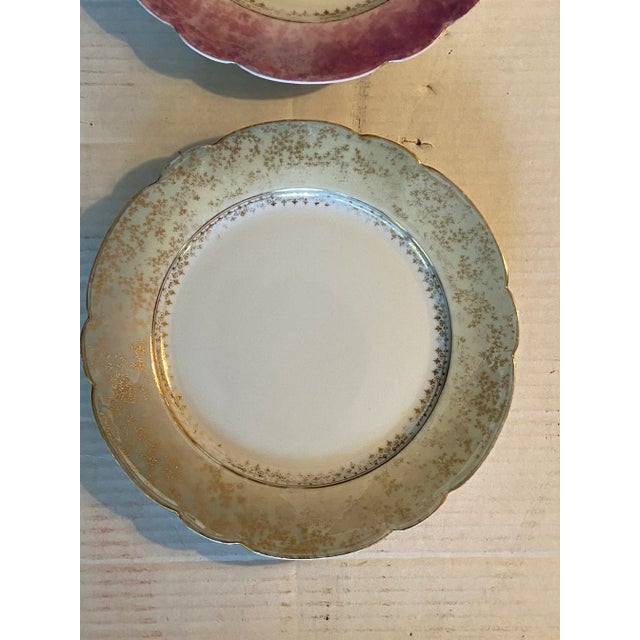 Early 1900s French Oscar Gutherz Limoges Plates. These hand-painted porcelain plates have a Lustreware-like appearance....