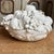 This Mid-Century modern Italian porcelain centerpiece bowl features a striking monochromatic aesthetic that captures the...
