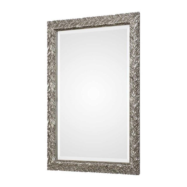 This flowing leaf design features a delicate, 3-dimensional texture, finished in a lightly burnished metallic silver....