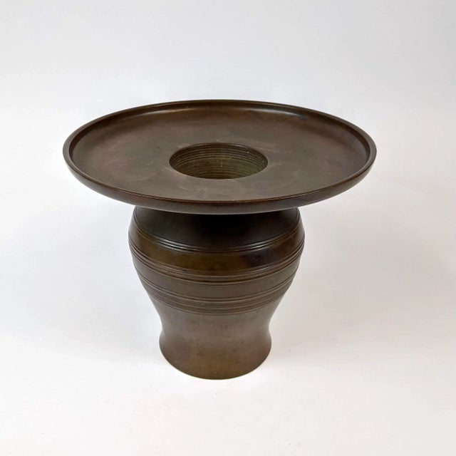 This is a bronze ichiban planter that separates into 2 parts. Very heavy!