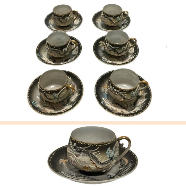 Stunning and delicate set of Japanese porcelain teacups. The cups and saucers have a raised dragon design using the...