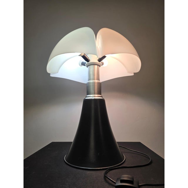 Gae Aulenti's Pipistrello Lamp for Martinelli Luce Designed in 1965 for the Olivetti showrooms in Paris and Buenos Aires....