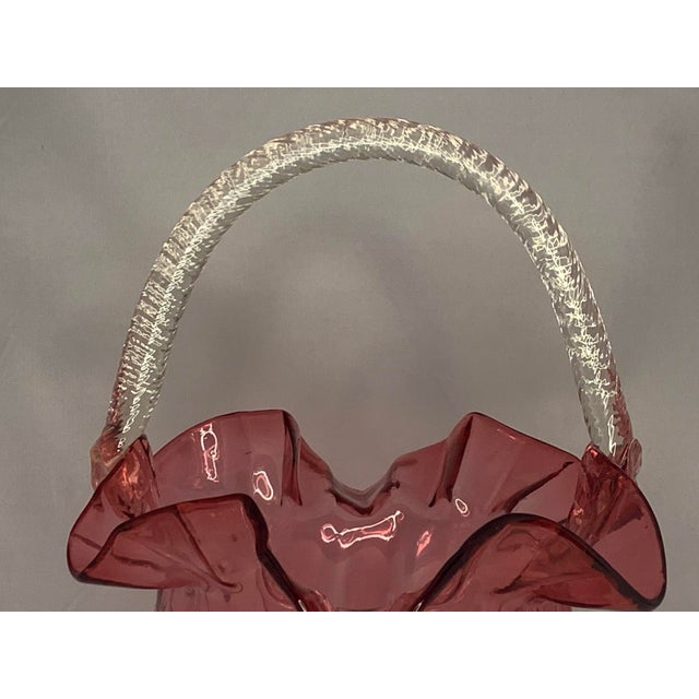 Victorian Cranberry Glass Basket for your consideration. The basket is large, measuring approx. 13 inches tall and 9...