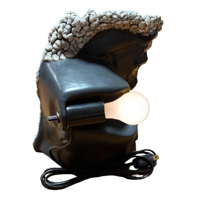 This striking Mid-Century TV lamp features a bold horse bust in a dramatic dark grey and white glaze. It captures the...