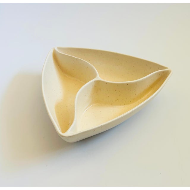 A mid century triangular ceramic divided serving bowl. Lovely white speckled glaze. Measures 9.25"W x 9"D x 2.25"H
