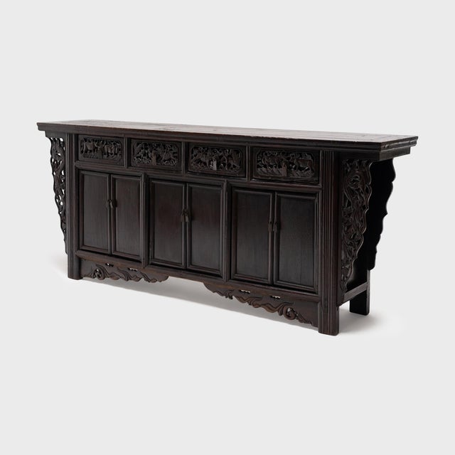 Well balanced and richly carved, this antique sideboard from Shanxi province is a beautiful example of Chinese cabinetry....