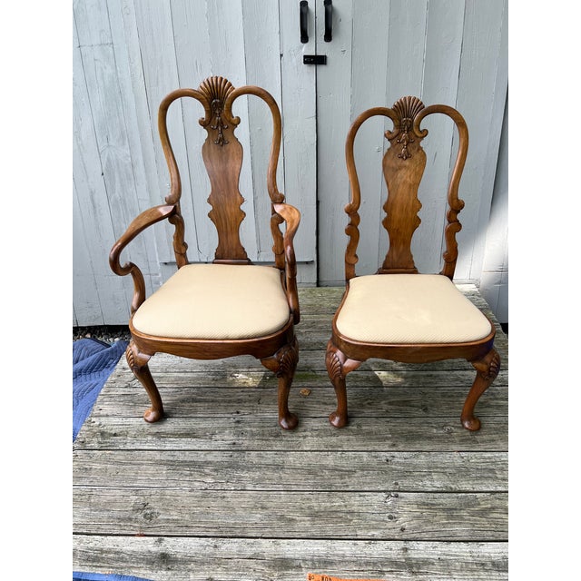 Vintage Queen Anne Revival style dining set with two armchairs and six side chairs in solid walnut wood. Originally sold...