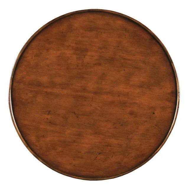 Designed in the spirit of 19th Century French originals, this handy table has a round cherry top that is surrounded by a...