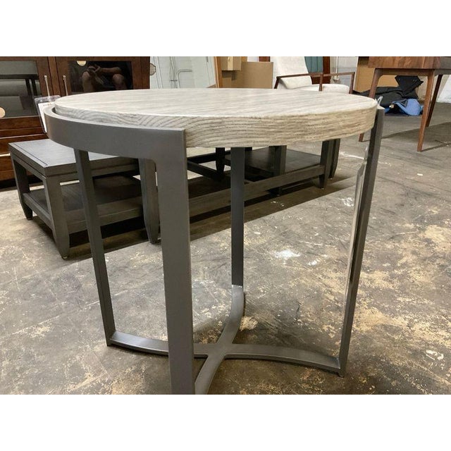 A beautifully designed contemporary accent table, the Bernhardt Exo features a cerused oak-style veneer top paired with a...