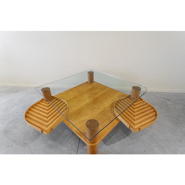 Great square center table with two turn -shaped rotating wings. Upper transparent glass cover with a rounded corner and 2...