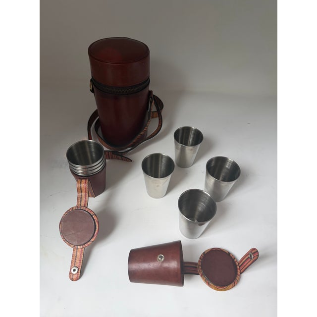 A rare and highly stylish vintage Paul Smith travel cocktail set featuring rich brown leather construction with the...