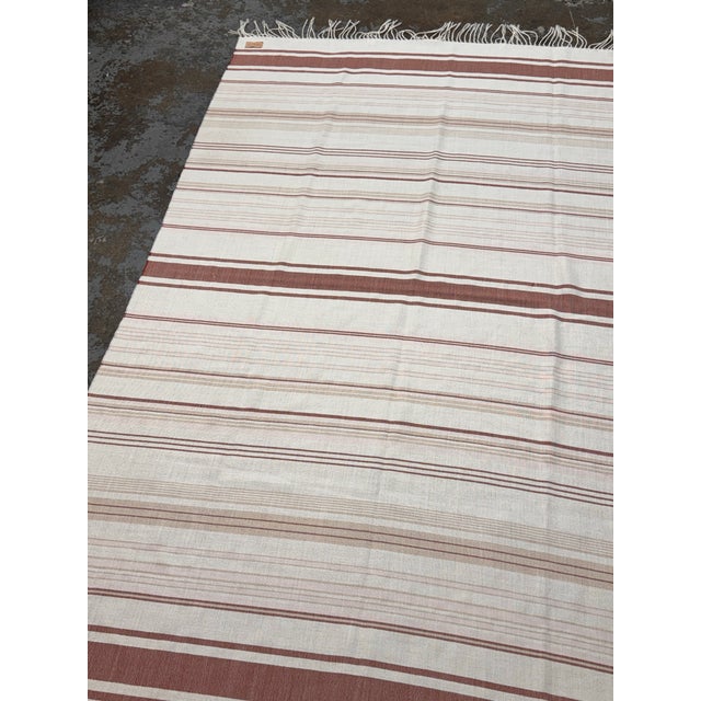Design Plus Gallery presents a Throw Blanket from Serena and Lily. Woven in an ivory tone with terracotta and taupe...