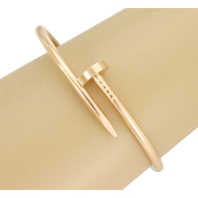 Elevate your jewelry collection with the Cartier Classic Juste un Clou bangle bracelet, a timeless piece crafted from 18k...