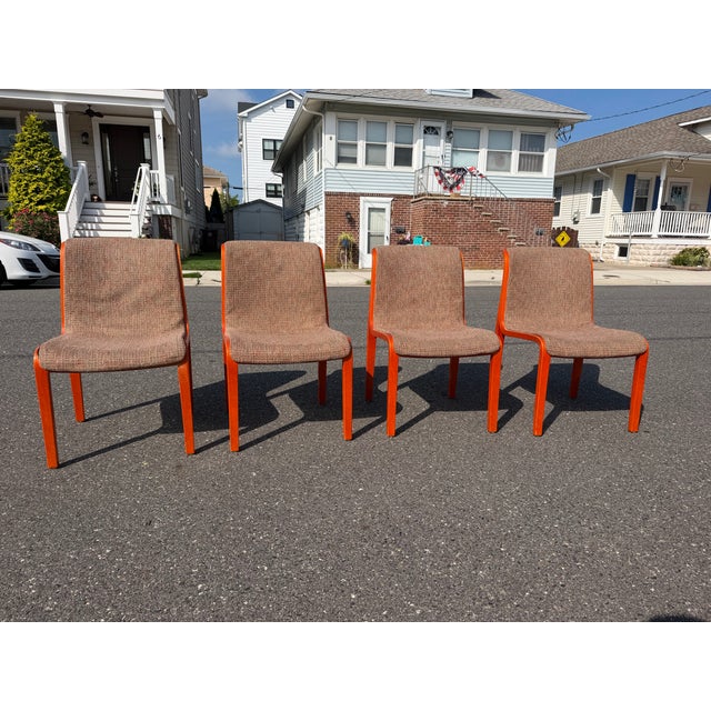 Bill Stephen’s for Knoll bent wood dining chairs. The chairs feature a retro orange tone bent wood and have the Knoll...