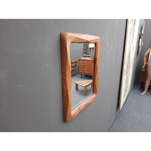 A beautiful Anthroposophical wall mirror. Handcrafted from alder wood. In very good original condition. The mirror surface...