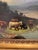 This is an 19th Century French Oil on Canvas, signed by the artist, and depicts cattle by a serene river basin with...