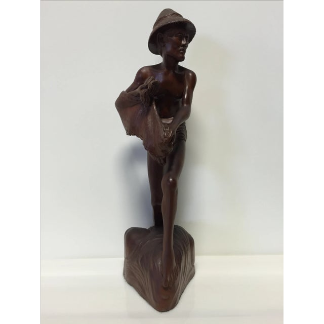 Hand carved solid rosewood Asian fisherman statue. Beautiful artistry and craftsmanship. Unsigned, artist unknown. Origin...