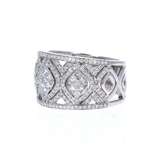 1.00 Carat Diamond 18 Karat White Gold Vintage Cocktail Band! This gorgeous vintage beauty is sure to make heads turn! It...