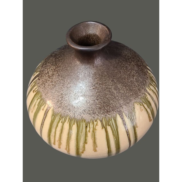 Crafted with a keen eye for design, this Vintage Mid-Century-Modern Art Pottery Vase is a testament to timeless...