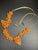 1950s Mid Century Modern Carved Floral Faux Coral and Pearls on Textured Brass Chevron Chain and Orange Push Clasp For Sale - Image 5 of 7