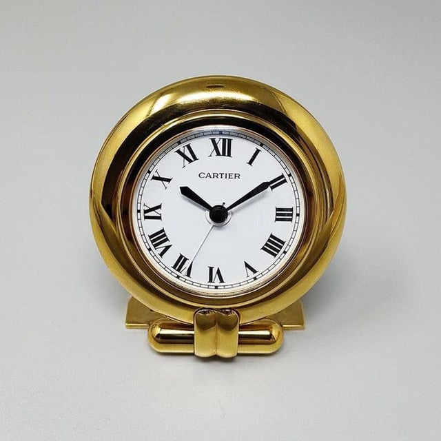 1990s gorgeous cartier alarm clock pendulette "colisee". Made in france it's in gold plated 24k. White enamel dial. Quartz...