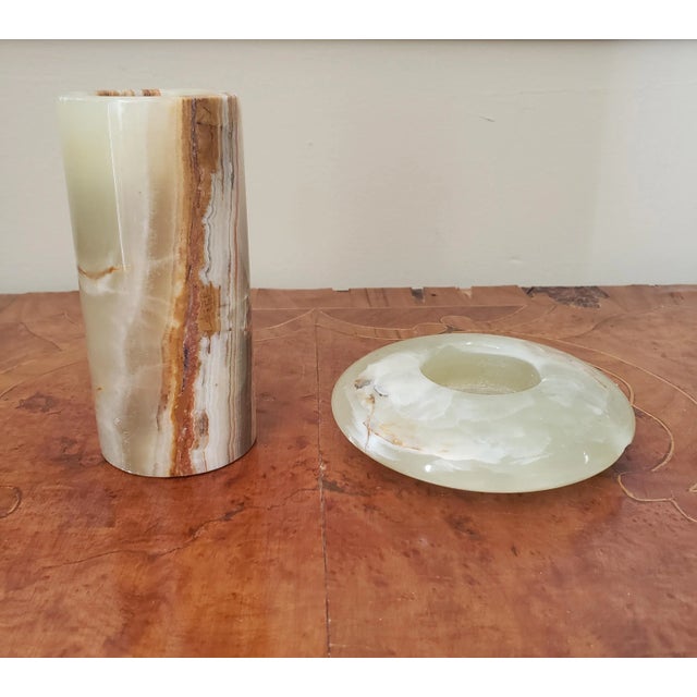 Two modern style candle stands in rich onyx marble. Tall one measures 2" in diameter and 4.5" tall. Candle hole is 1.5" in...