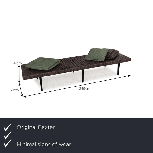 The Garcon lounger from Baxter is covered in brown genuine leather and stands on black feet. It is characterized by its...