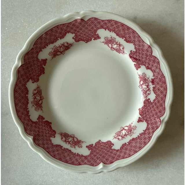 Set of 5 vintage red and white ceramic small plates with a scalloped edge and red lattice and fruit transfer pattern on...