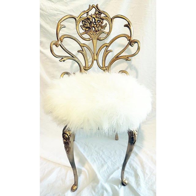 Tickle you fancy with this fun gilt metal vanity chair and it's faux-fur pouf of a seat (easily reupholstered as desired)....