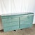 A striking example of late-20th-century design, this sculptural dresser features a bold faux-granite teal finish and a...