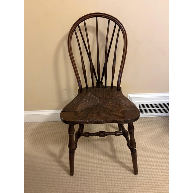 Authentic matching pair of early 20th-century Windsor-style side chairs, expertly crafted by the iconic Chicago...