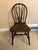 Authentic matching pair of early 20th-century Windsor-style side chairs, expertly crafted by the iconic Chicago...