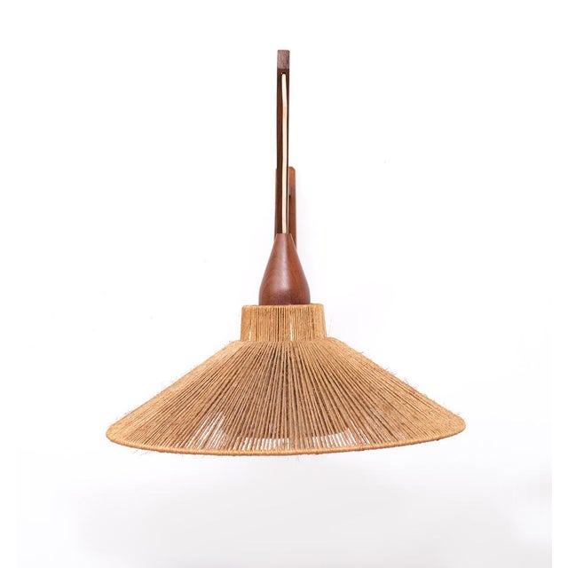 Unique wall lamp. Teak wood comes with a Sisal Shade and inner shade . Temde Leuchten 1960s Very good condition . One...