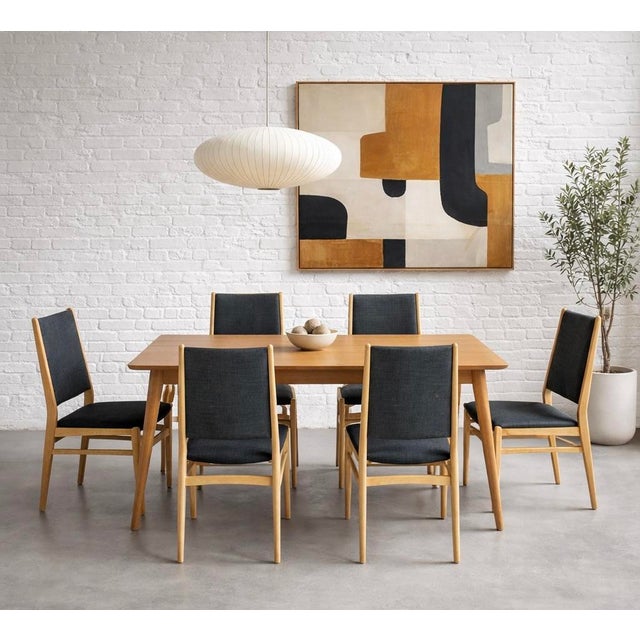 Set of six Danish Mid Century Modern dining chairs, crafted in Denmark circa 1960s. These chairs feature elegantly...