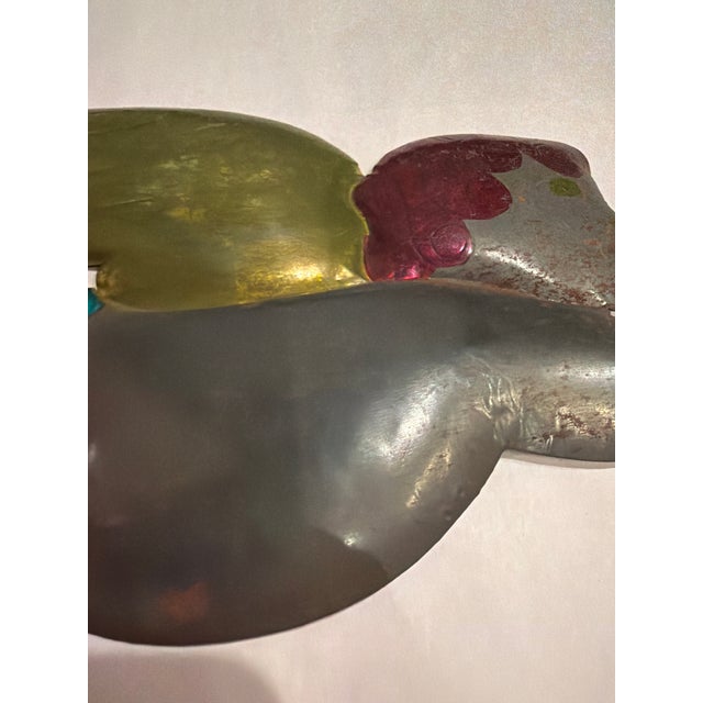A striking pair of vintage metal trumpeting angels with luminous colors reminiscent of treasured vintage Christmas...