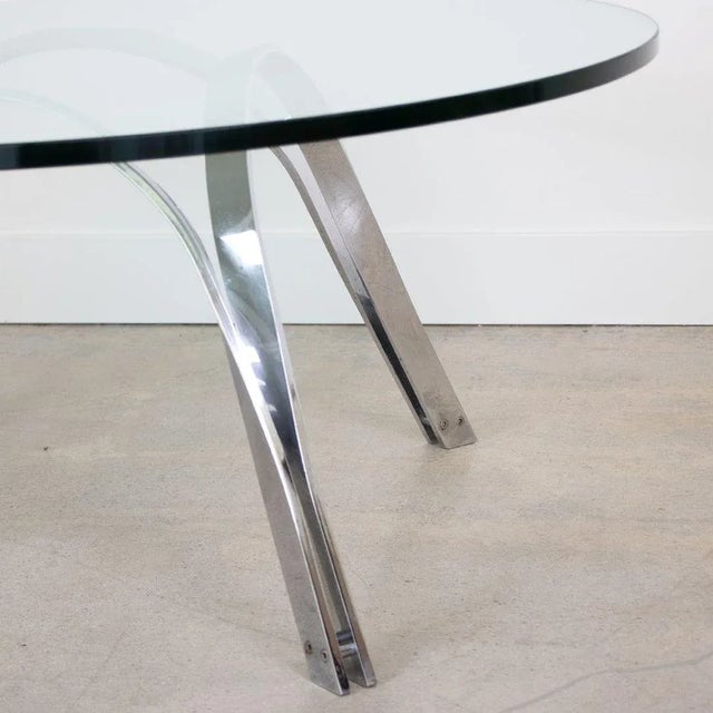 Chrome coffee table designed by Roger Sprunger for Dunbar. Arched chrome base can be flipped upside down and used both...