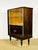 Elegant Art Deco display cabinet, bar, or sideboard in Macassar ebony, dating from the 1940s. The upper section is glazed,...