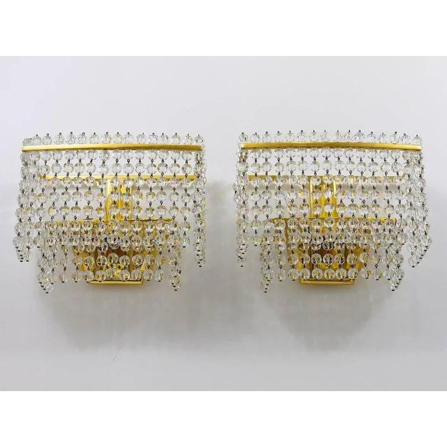 A pair of gold-plated mid-century brass sconces. Designed and executed in the 1970s by j. L. Jobmeyr. Very beautiful...