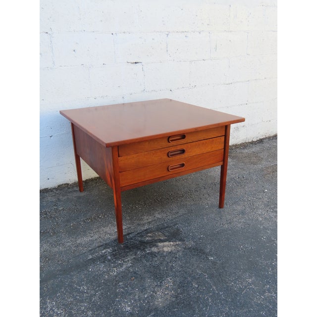 This beautiful Nightstand is made out of wood, walnut, and veneer. We believe the Table was made by Jack Cartwright for...