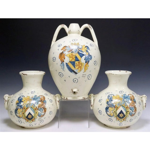A vintage Italian majolica ceramic three piece garniture set, signed Leona Italia. Hand-crafted and hand-painted by highly...