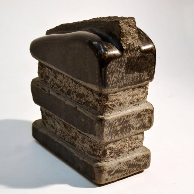 Two abstract hand-carved sculptures by the Dutch artist J. Metaho made in the 1970's. They are both composed in...