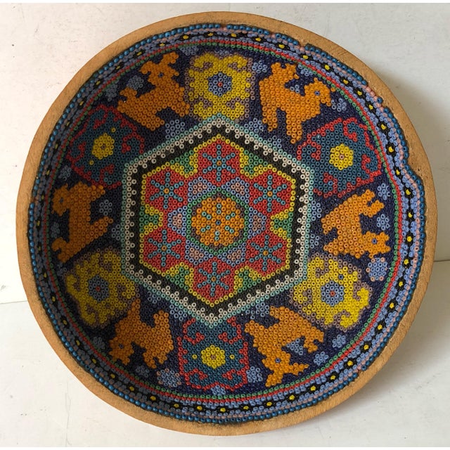 Traditional bead art by Huichol First Nations tribe fashioned inside of a gourd bowl. Incredibly detailed motifs with...