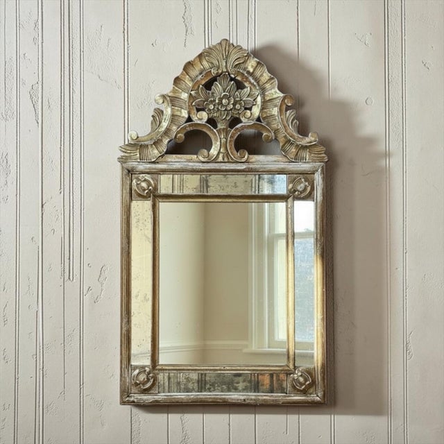 Few pieces carry the romance of the eighteenth century as beautifully as this Italian Neoclassical period mirror, with its...