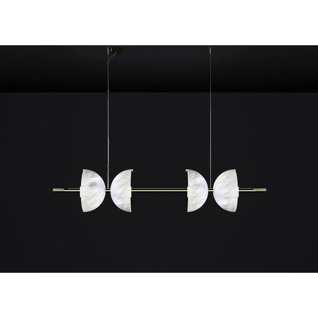 Ermes shiny gold metal and alabaster pendant light 2 by alabastro italiano dimensions: d 30 x w 150 x h 300 cm. Materials:...