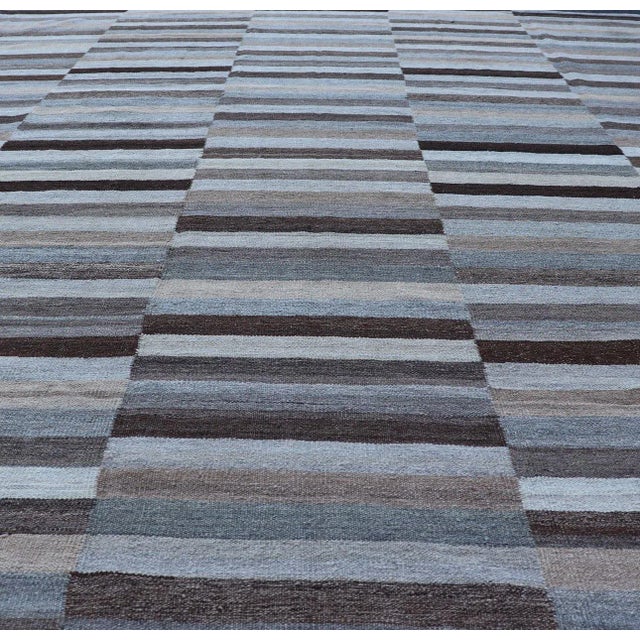 Modern flat-weave Kilim rug with stripes in shades of light ocean blue, charcoal, gray and cream. Keivan Woven Arts / rug...